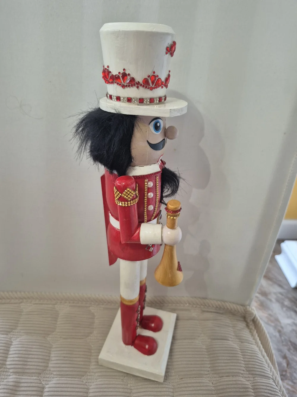 Red and White Nutcracker Holiday Figurine With Horn